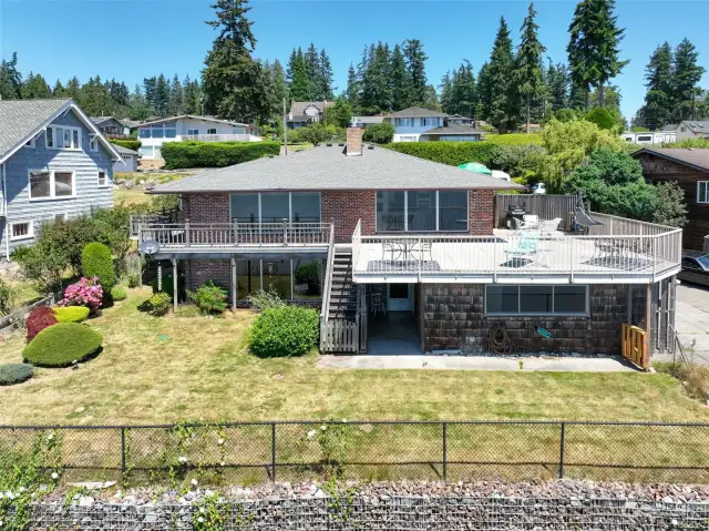 Drone shot of the back of the house...note the bluff stabilization beside the fence.