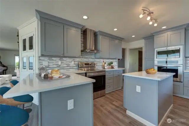 Updated stunning kitchen has high end SS appliances...virtually staged.