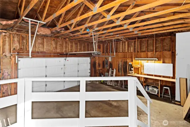 Spacious garage with workshop table.