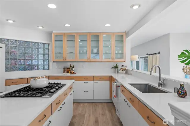 kitchen with upper glass cabinets quartz counters