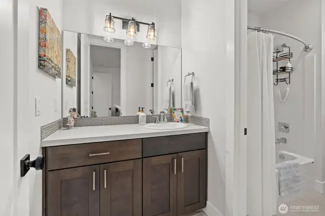 The shared full bathroom features a tub/shower combo and dual entry, offering both privacy and convenience.