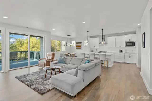This bright, open-concept layout effortlessly connects the kitchen, dining, and living areas—ideal for entertaining or everyday comfort.