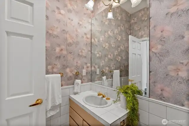 1/2 bath on the main, right next to the Primary.