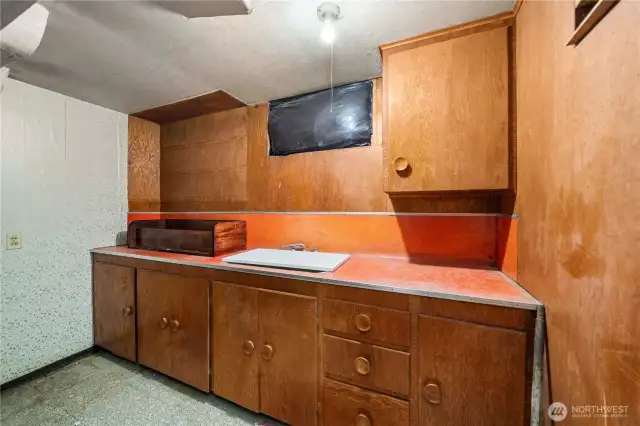 Kitchenette behind closet in lower level bonus room.
