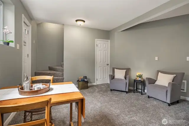 Dining area opening into living space with easy access to upper half-story.