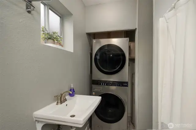 In-unit washer/dryer located in full bathroom.