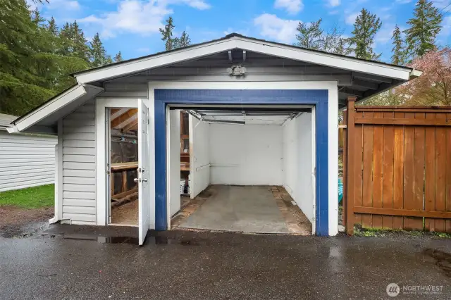 Single-car garage including an attached shop.