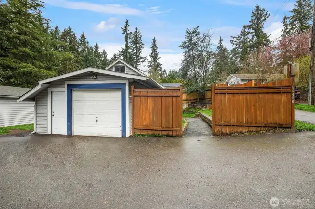Single-car garage featuring gated entrance.