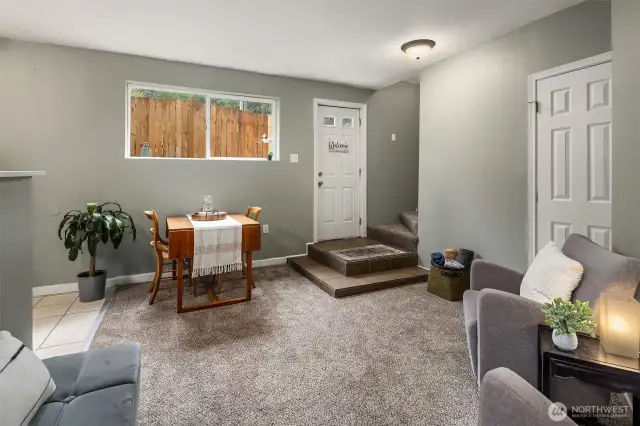 Living area with window providing ample natural light to flow throughout.