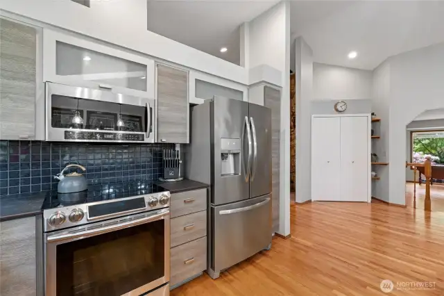 Stainless appliances and lovely backsplash compliment this beautifully updated kitchen.