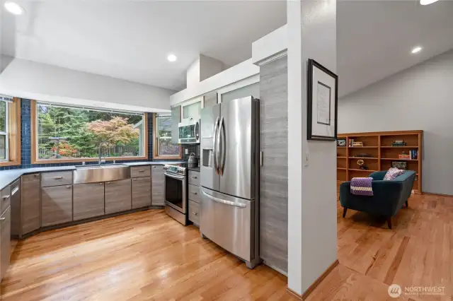 The large window over the sink looks like framed art!