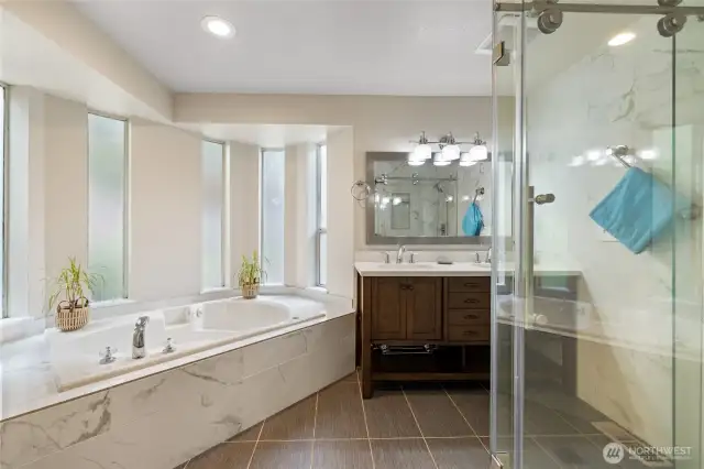 Nicely updated primary bath with walk in shower and jetted tub!