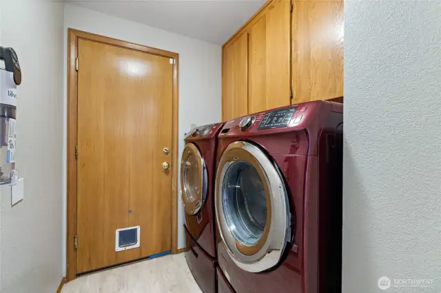 Utility room leads to the garage. Washer & dryer stay with the home.