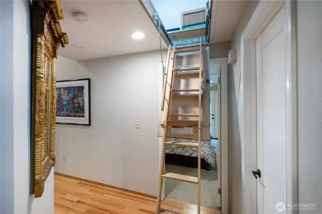 Just up this ladder is a HUGE finished attic! It is currently being used as an extra bedroom. Think of the storage space!