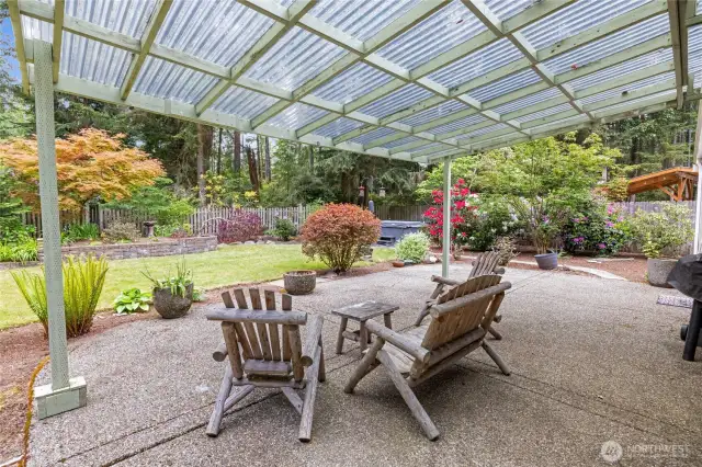 Enjoy your outdoors year round with this awesome covered patio! Look straight ahead to the right and see the new HOT TUB  that stays with the home!