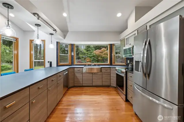 The kitchen has ample cabinets and a sleek modern vibe.