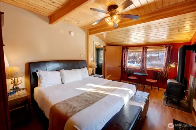Unit 1 bedroom.  All units have freestanding propane stove for warmth and ambiance.