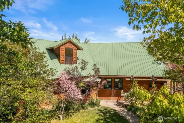 1581 Thomas Rd is out of a story book with privacy, mature landscaping, and careful details throughout.