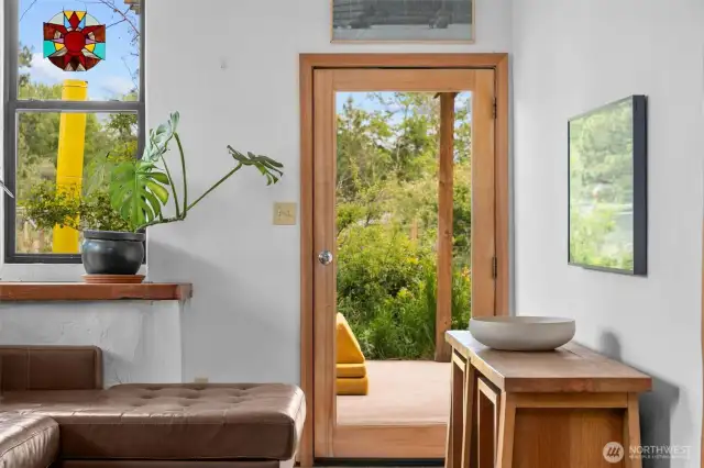 Peekaboo shot out to the patio space accessed through the living area and the pantry.