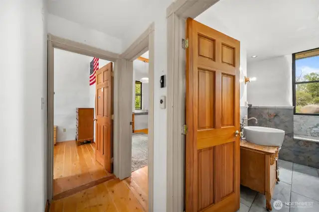 Hallway to two downstairs bedrooms and main bath.