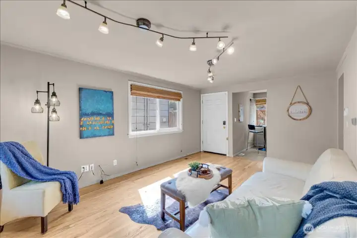 Enter to spacious living room with beauiful hardwood floors and lots of natural light