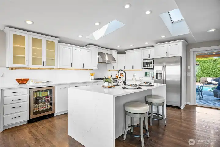 Open, spacious kitchen complete with eat in bar and gas stove.