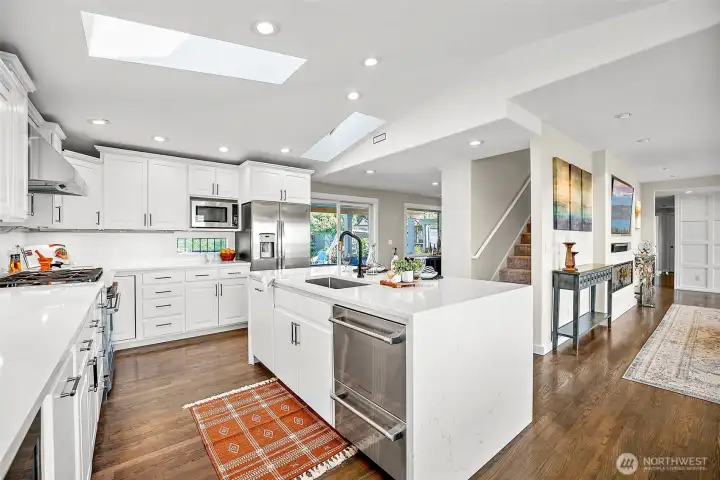Another view of the kitchen showcasing the open entertaining space with access to the living room, dining room and back yard.