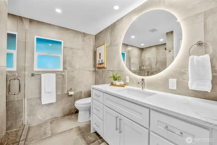 Guest bathroom on the main floor has been recently remodeled with luxurious updates. The lit mirror is also fog resistant!