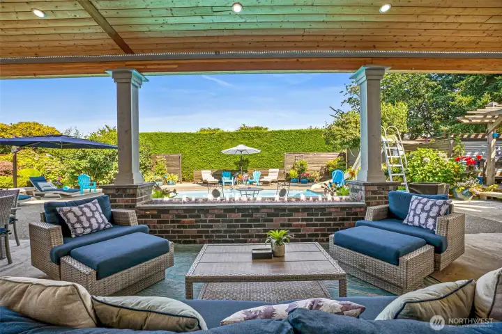 Finally, out back to the amazing back yard! This is 850sq ft of covered patio space complete with tongue and groove fir ceiling and gas plumbed fireplace.