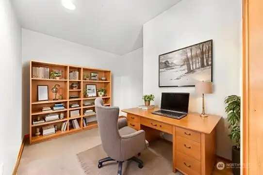 Virtually staged office off great room.
