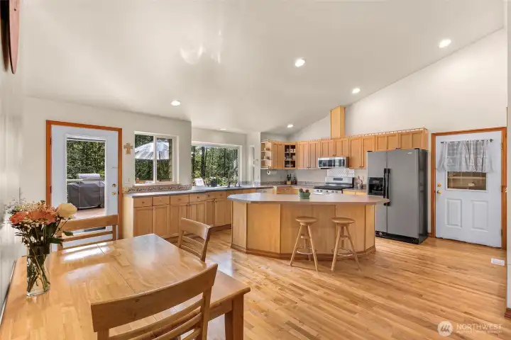 Open kitchen with island and plenty of cabinetry