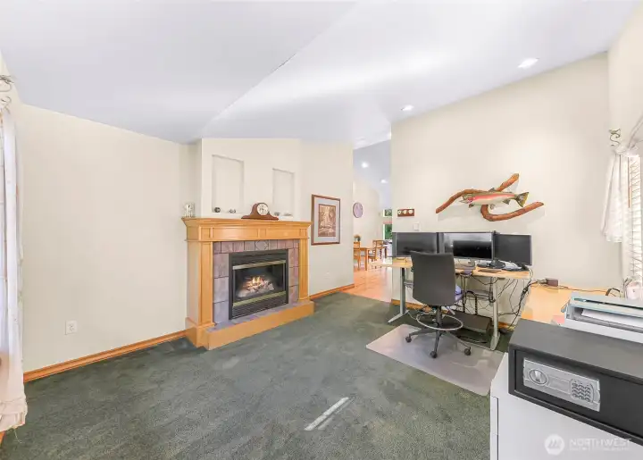 Formal living area featuring gas fireplace. (currently being used for home office)