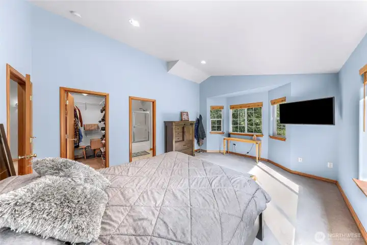 Primary bedroom, offering full bath, walk in closet, and plenty of windows for natural light.