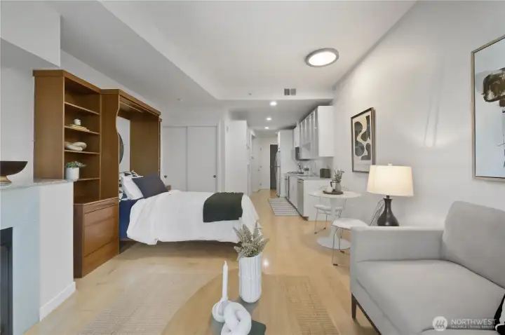 Check out this open & gracious living space with custom Murphy Bed for maximum storage & efficient living!