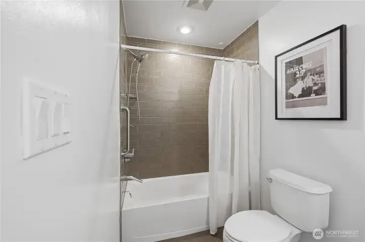 Beautiful tile bath & showerhead.