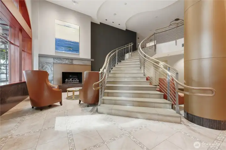 Gorgeous lobby with grand stairwell leads to private conference room & business area with computer & printer.