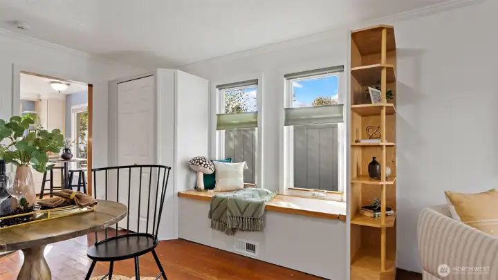 That built-in window seat isn’t just for looks - it lifts to reveal hidden storage below! The top-down, bottom-up blinds make it easy to let in just the right light. And see that white door? It leads to a second pantry with seriously sturdy shelving - the seller once stored cases of homemade blackberry wine in there!