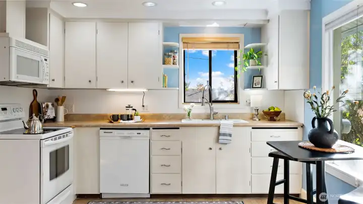 If you’re lucky - and maybe stand on one foot, lean just the right amount, and squint a little - you’ll catch a peekaboo view of the Sound from the kitchen window in winter!