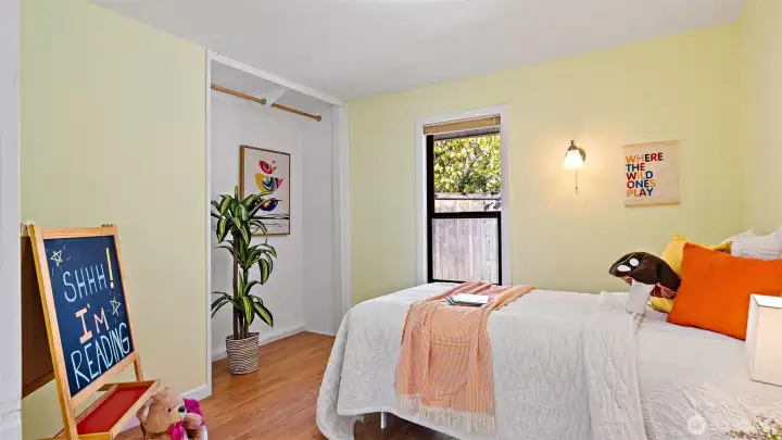 The second bedroom is painted a fresh spring green that feels sweet and refreshing. Will you make it a cozy guest room, a bright home office, or your favorite gaming spot?