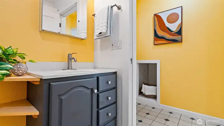 The seller thought the bathroom could use a little more surface space, so he added two custom corner shelves next to the vanity - beautifully built and perfectly practical. Every project in this home shows his incredible craftsmanship and attention to detail!