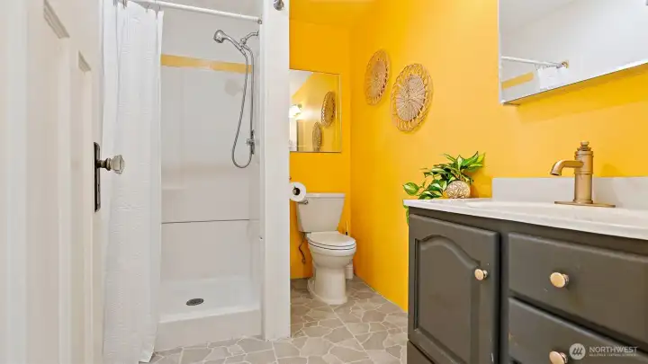 The three-quarter bath features a shower - no leaning over a tub to scrub in this house! Easy to clean and even easier to love.