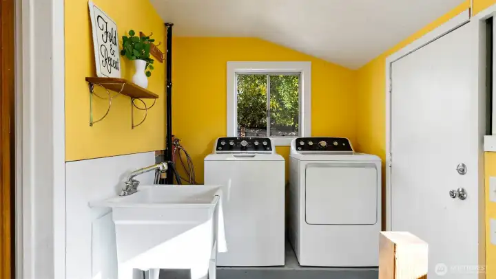 Super cute laundry room with a handy utility sink, plus a washer and dryer that are just a year old - and they stay! Fresh, functional, and ready to make daily tasks just a little bit easier.