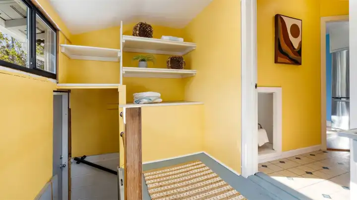 This indoor stairwell to the basement is an amazing addition - no more trekking around the outdoor deck to get downstairs! It feels natural and seamless now, connecting the main level to the lower space with ease and practicality.