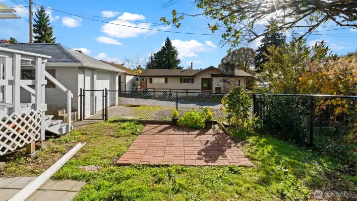 Can you believe it - there’s even more yard to enjoy! This great patio area is perfect for a picnic table, container garden, or a cozy outdoor setup all your own. It’s an inviting space ready for whatever you imagine.