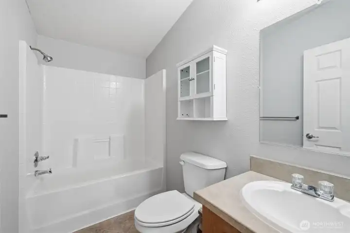 Full bath near second and third bedrooms.