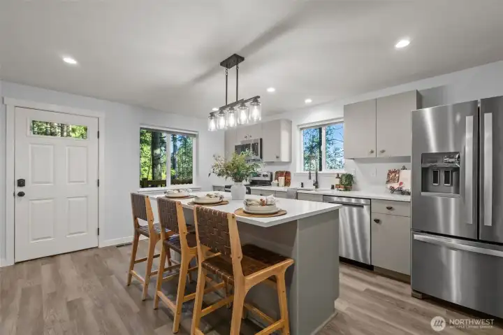 Eat-in kitchen bar at the large island is the perfect summer chill spot! :)