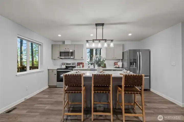 Beautiful kitchen with modern finished, custom touches and a large island with storage!