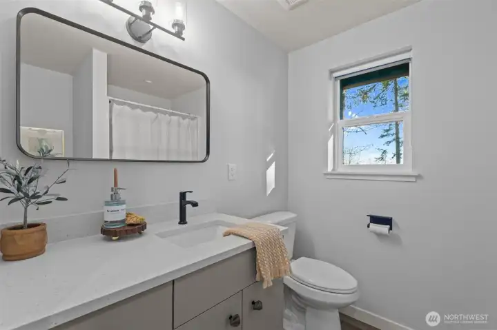 3/4 bathroom with added storage and a potential linen closet spot