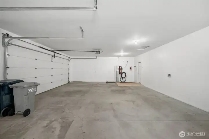 Large 3 car garage with ample space for all your toys and storage.