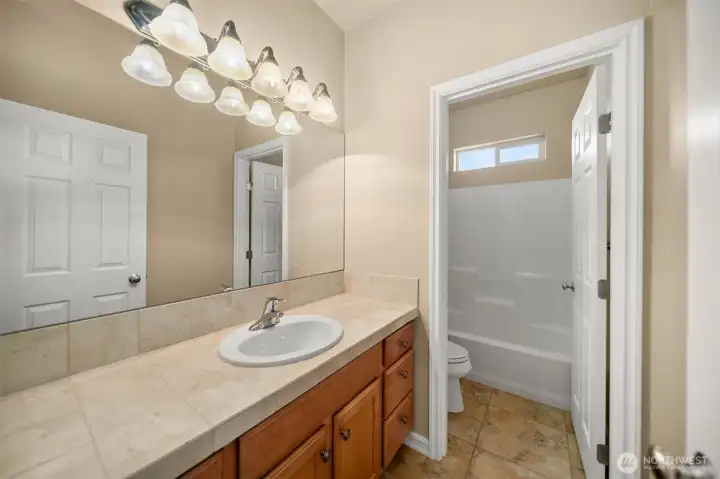 A separate second bathroom on the other end of the house gives guests privacy.